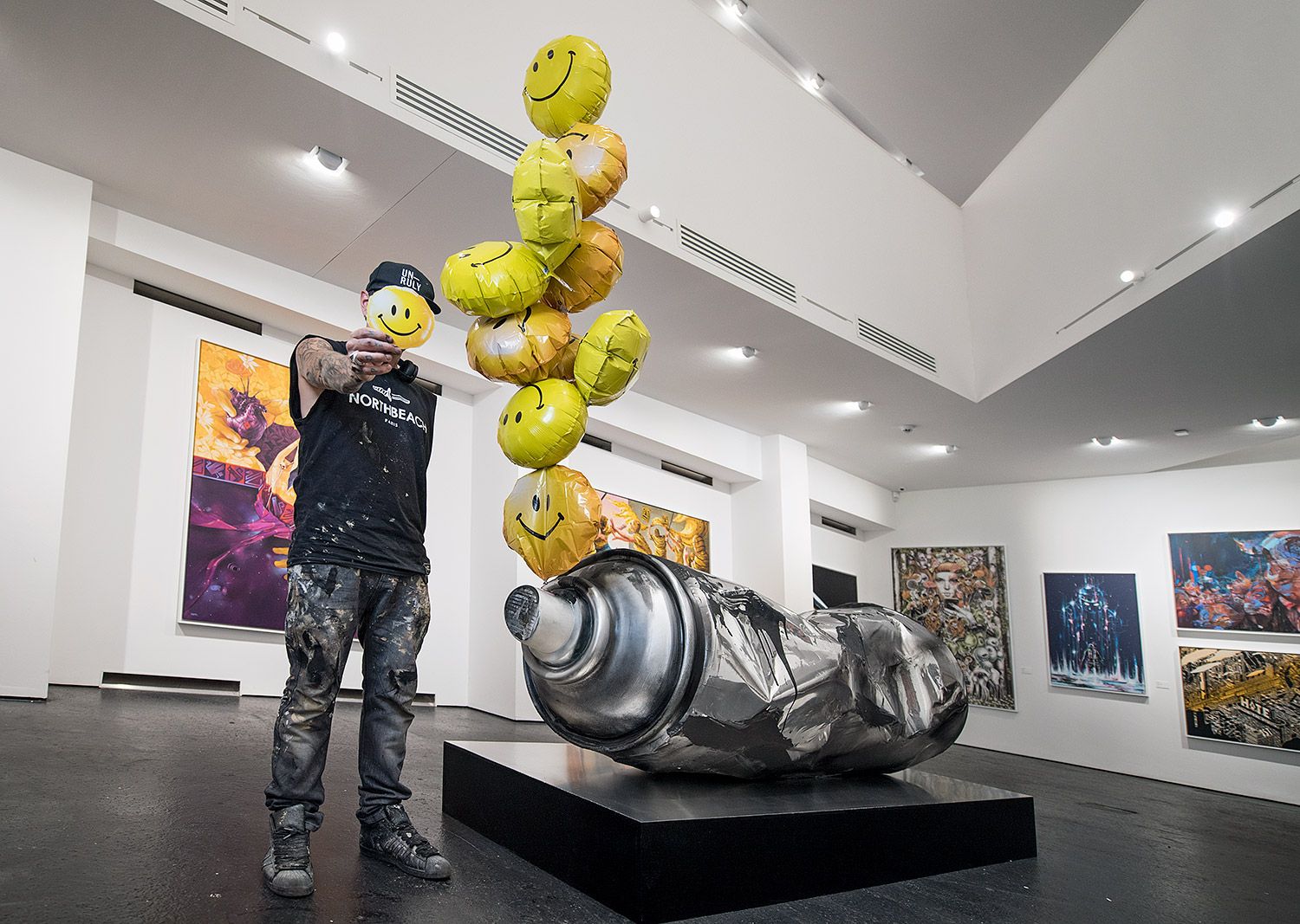 Fanakapan beside his spray-can sculpture at URBAN NATION