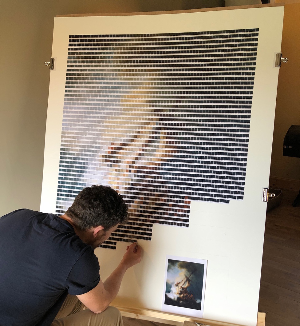 Nick Smith adding a colour chip to his interpretation of Storm on the Sea of Galilee in his studio.