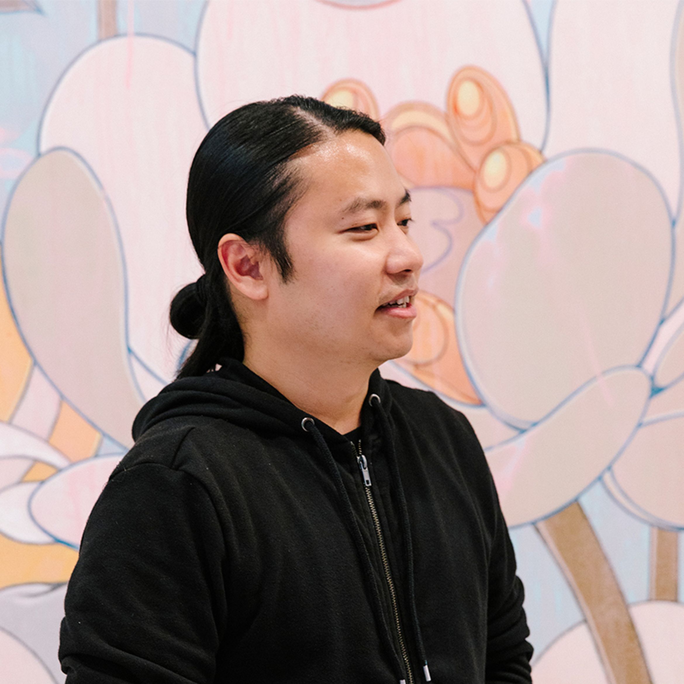 James Jean in his studio wearing a black hoodie
