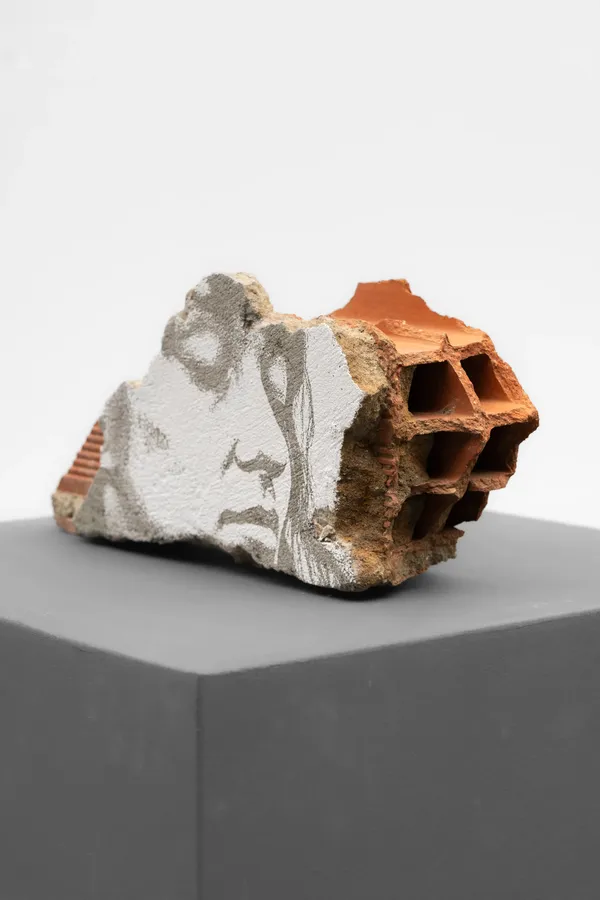Estrato Series #03 (2026) by Vhils: Laser-engraved fragment from demolished building (brick, plaster, concrete, paint).