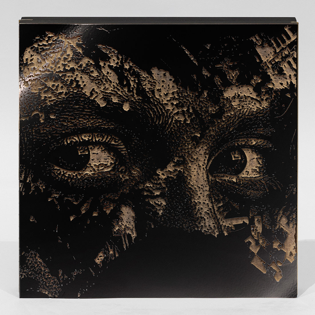 Home: Hugo Oliveira and Vhils laser-etched laminated wood-composite album cover.