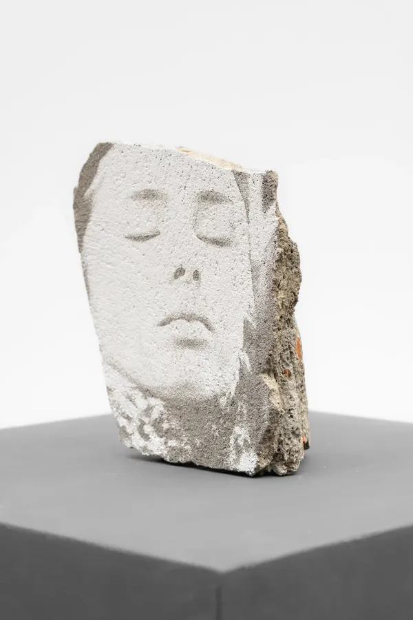 Estrato Series #02 (2026) by Vhils: Laser-engraved fragment from demolished building (brick, plaster, concrete, paint).