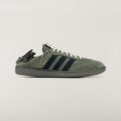 adidas Samba OG SFTM HP8257 in Base Green with Core Black stripes, cream laces and gold Samba lettering, side view.